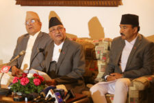 Prime Minister KP Sharma Oli (c) speaks with journalists upon his arrival at the Tribhuvan International Airport from an official China visit, in Kathmandu, on Sunday, March 27, 2016. Photo: RSS